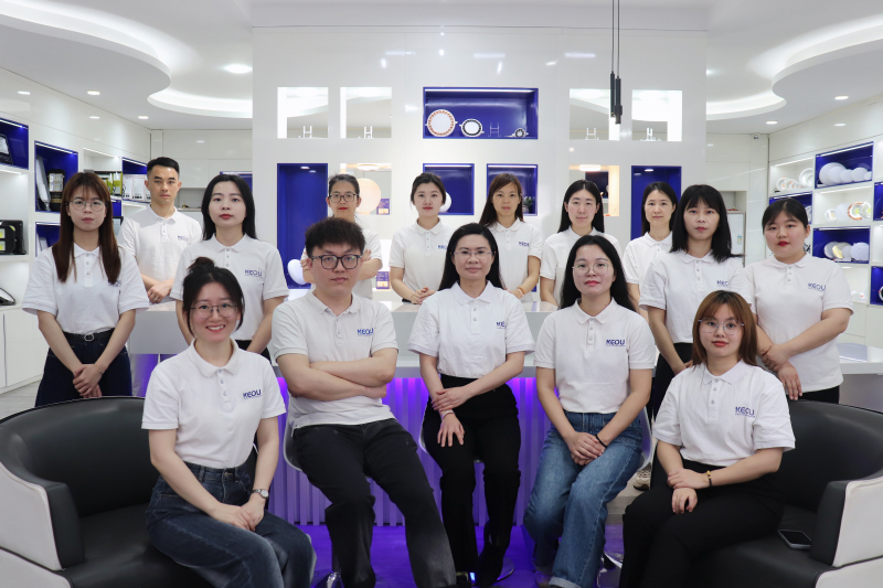 Sales Team Group photo of KEOU Lighting sales team in LED light showroom with full range indoor lamps